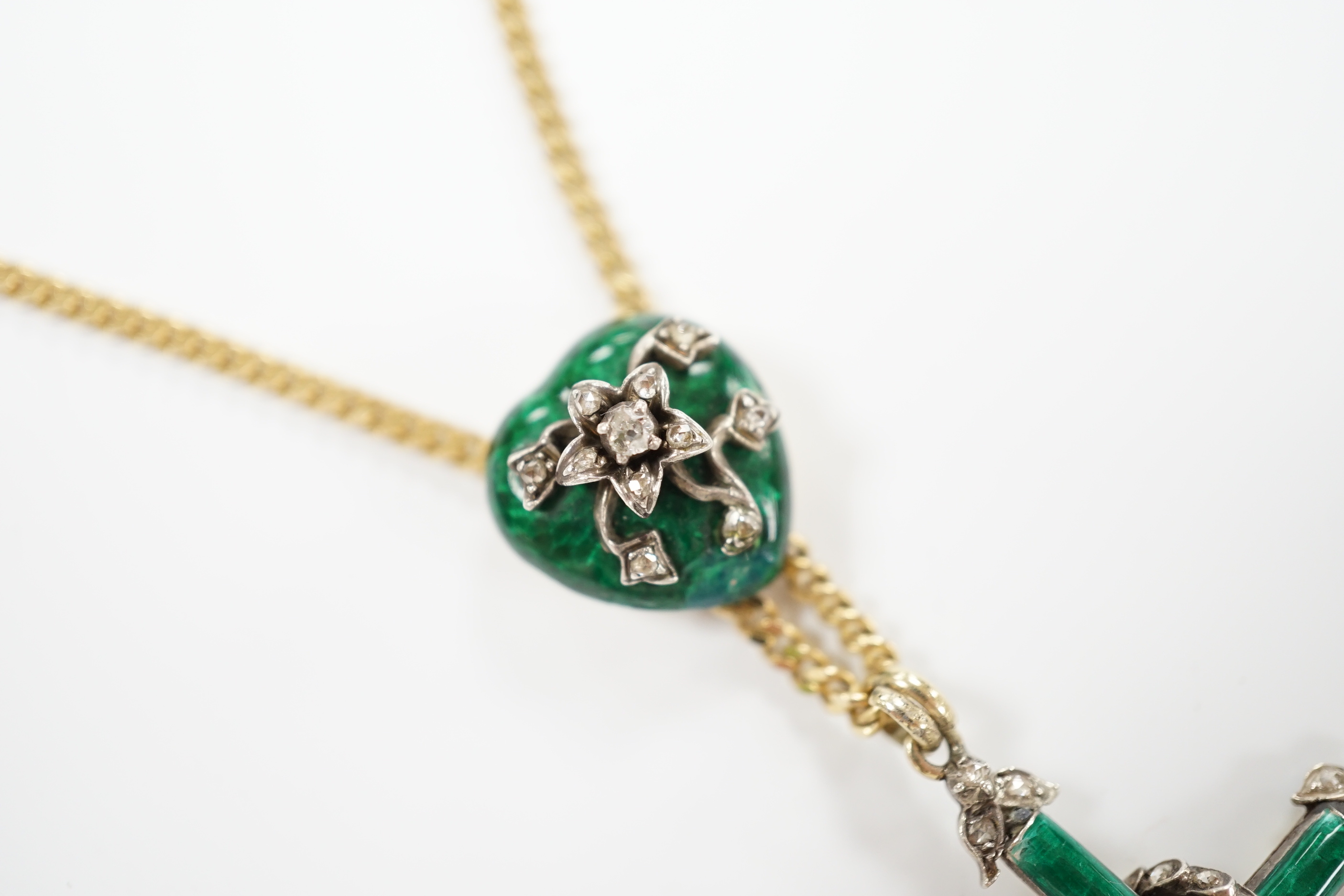 A 19th century yellow metal, green enamel and rose cut diamond set cross pendant, with entwined serpent and heart shaped slider, now on a later Italian 9ct gold chain, overall 58cm, gross weight 16.5 grams.